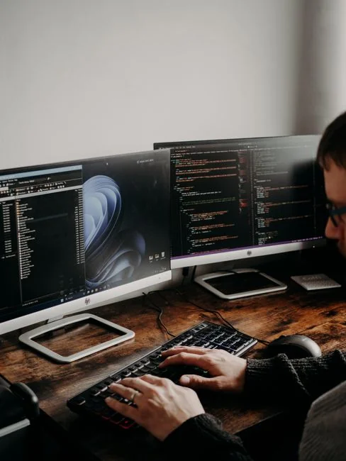 A person using a laptop to browse stock photo websites. Freelancing work in a cozy setting.